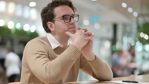Man Thinking in Office