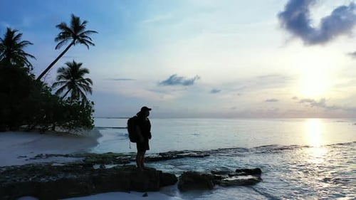 Girl enjoys life on beautiful island beach time by blue ocean and white sandy background of the Mald