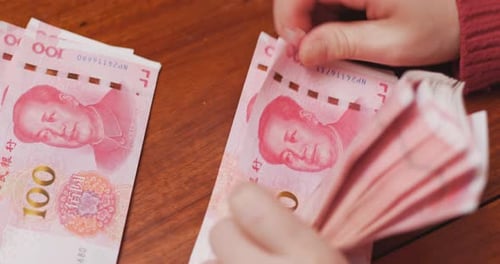 Counting Chinese Yuan Renminbi Banknotes Currency Money Cash