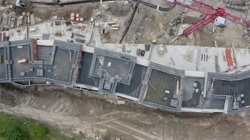 Overhead view of rooftops of unfinished apartments,construction site.