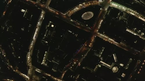 AERIAL: Slow Overhead Shot of City at Night with Lights and Traffic, Cologne, Germany