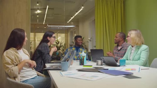 Positive Business Team Fist Bumping in Office