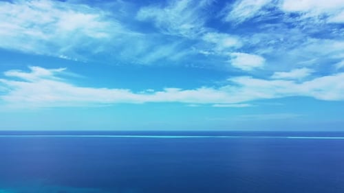 Wide angle flying tourism shot of a summer white paradise sand beach and turquoise sea background in