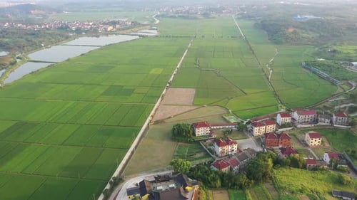 Mountain village and farmland in the sunset