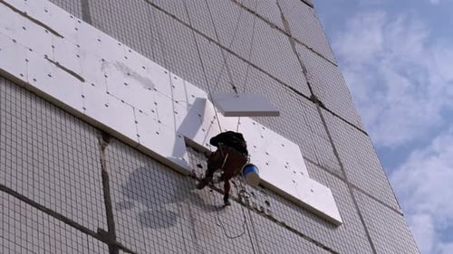 Industrial Climber Insulation of Facade Old High-Rise Building Using Styrofoam