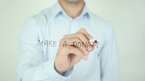 Writing Make a Donation on a Clear Surface