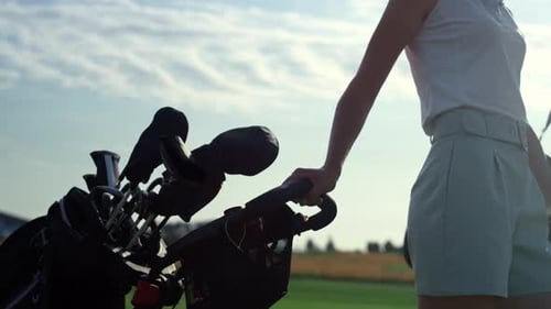 Golf Person Taking Clubs Bag Trolley in Country Club