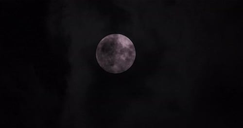 Full Moon Glowing in Dark Night Sky