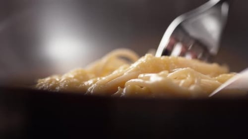 Close-Up of Creamy Pasta Carbonara Being Served
