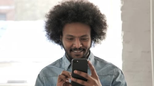 Young Adult Using a Cell Phone