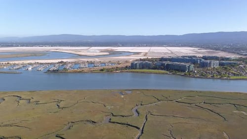 Aerial of Marina, Corporate Buildings, Salt Flats, and Wetlands in SF Bay Area