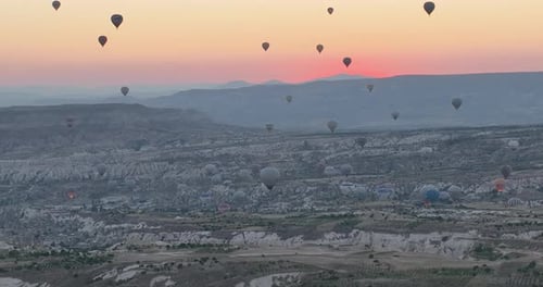 Aerial Cinematic Drone View of Colorful Hot Air Balloon Flying Over Cappadocia
