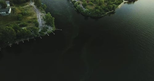 Flight Over the Boat Station, River at Sunset. Algae Bloom, Environmental Disturbance