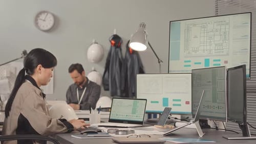 Professional Engineers Working in Design Office