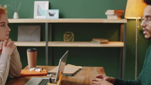 Two Professionals Meeting Together in an Office