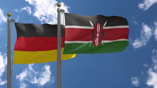 Flags of Germany and Kenya Waving Together Against a Cloudy Sky