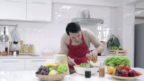 Man Preparing Healthy Salad in Modern Kitchen