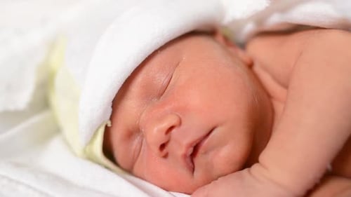 Infant Sleeping Peacefully in Hospital, Close-Up