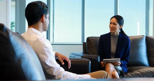 Business colleagues interacting with each other