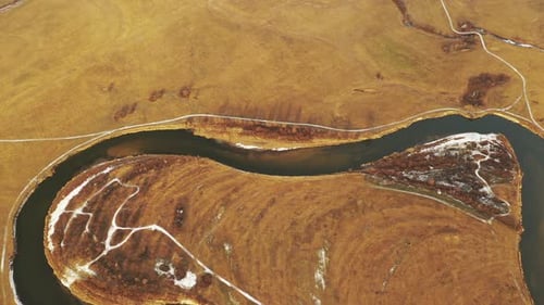 Aerial View Of Forest Woods And Partly Frozen River Landscape In Sunny Late Autunn Day
