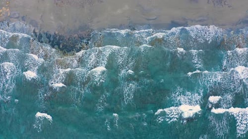 Flying above Sea Coast Line. Aerial of sand beach. Fly over Beautiful Waves in the Ocean