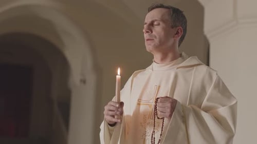 Devout Man Praying with Candle and Rosary
