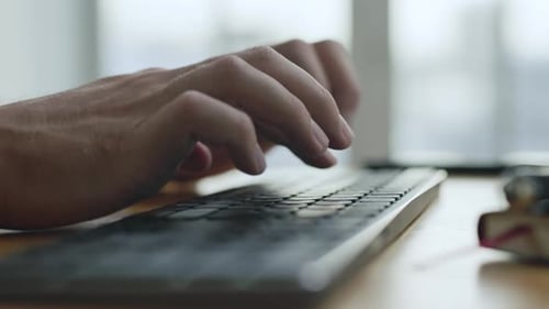 Working Business Man Typing on Computer Keyboard in Office Closeup
