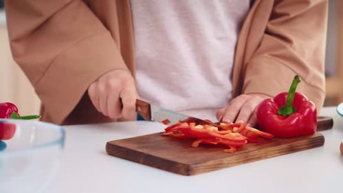 Hands Close Up Slicing Pepper