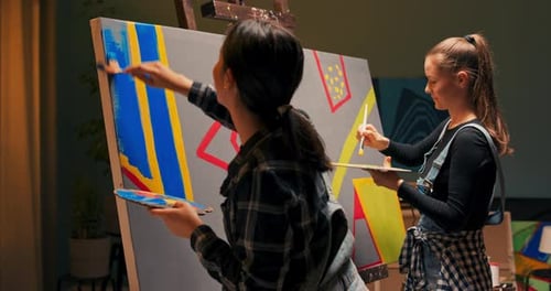 Artists in Dungarees and Checked Shirts Create a New Modern Abstract Painting Using Acrylic Paints