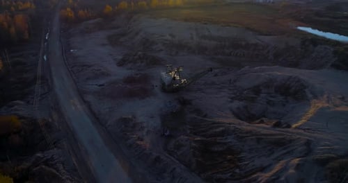 Aerial View of Mining Excavator in Rural Quarry