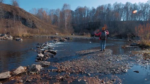 Traveler Walks Near River Water