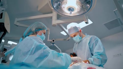 Surgeons Perform Operation in Hospital Operating Room