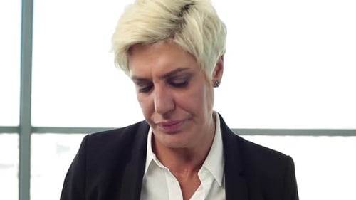 Professional Woman Putting On and Removing Glasses