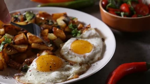 Breakfast Plate with Fried Eggs and Potatoes
