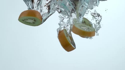 Kiwi Slices Falling into Water