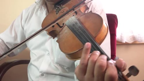 Man Playing Beautiful, Classical Violin in Bright Room