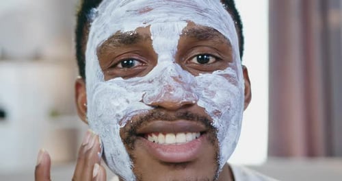Man Applies Facial Mask, Close Up Skincare Treatment