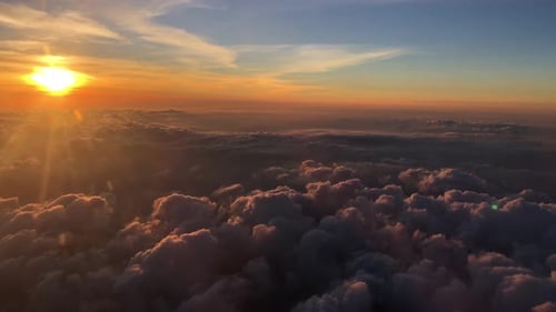 Dramatic Sunset Over Clouds from Above