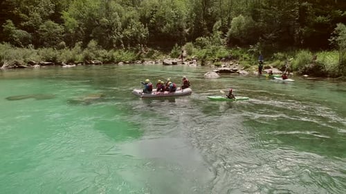 Aerial view of a group sitting in the boat preparing for rafting in Soca River.