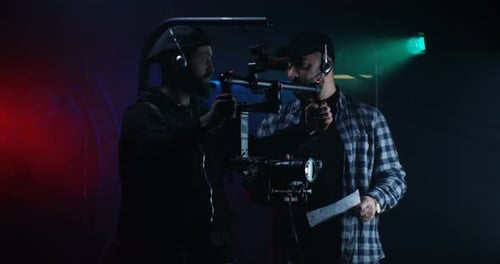 Director Instructing Young Cameraman