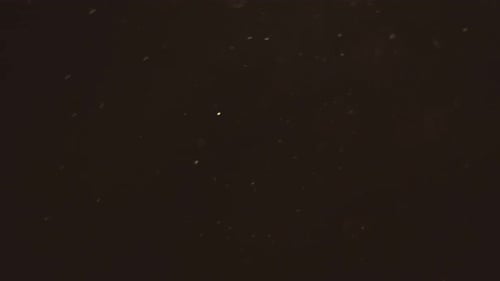 Partikel fliegen auf schwarzem Hintergrund