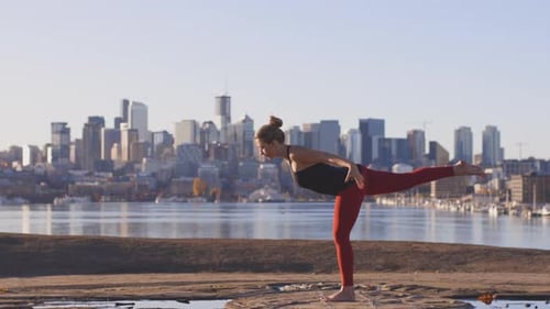 Power Yoga Practice - Eagle Warrior 3 And Tree Stand By Strong Woman In City Landscape