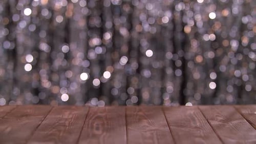 Wooden Table and Silver Bokeh Background