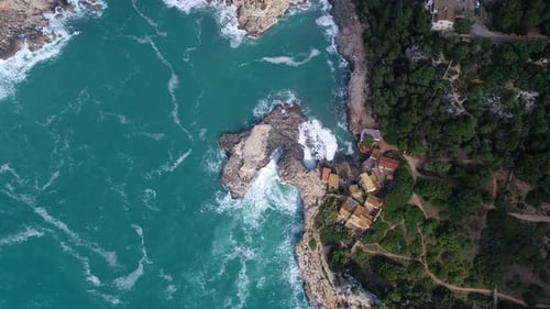 Dramatic Waves Crashing on Rocky Coastline from Above