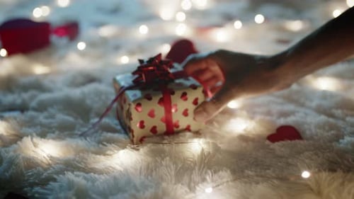 Romantic Gift Placed on Fluffy Surface with Heart Decorations