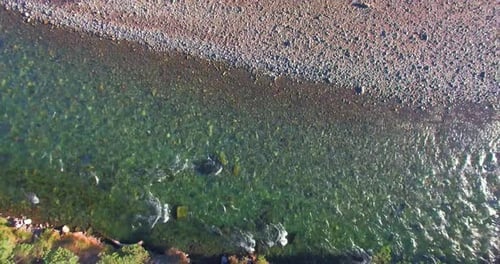 Low Altitude Flight Over Fresh Fast Mountain River with Rocks at Sunny Summer Morning