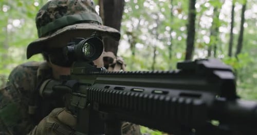 Fully Equipped Rifle Soldier Wearing Camouflage Uniform Attacking Enemy Rifle in Firing Position in