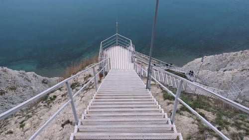 Scenic steep stairway leading down to sea coast
