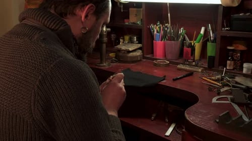 Man Working on Jewelry in Workshop