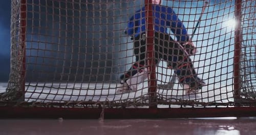 Hockey Player Carries Out an Attack on the Opponent's Goal and Scores a Goal Puck